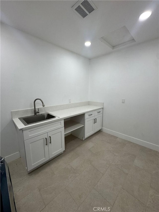 54889 Navajo Trl, Yucca Valley, CA 92284 - washroom featuring attic access and recessed lighting