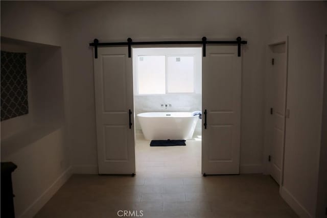 54889 Navajo Trl, Yucca Valley, CA 92284 - bathroom with a soaking tub and baseboards