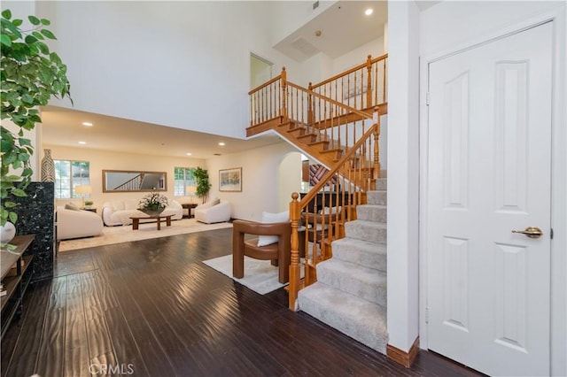 325 E Duarte Rd Unit C, Arcadia, CA 91006 - stairs featuring a high ceiling, wood finished floors, and recessed lighting