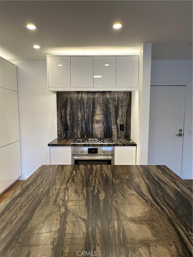330 N Jackson St Unit 313, Glendale, CA 91206 - kitchen view of stainless steel appliances, dark countertops, tasteful backsplash, modern cabinets, and recessed lighting