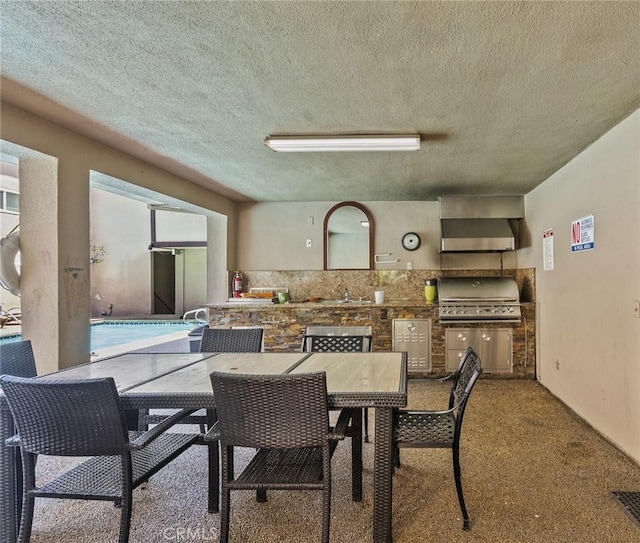 330 N Jackson St Unit 313, Glendale, CA 91206 - dining room featuring a textured ceiling and carpet