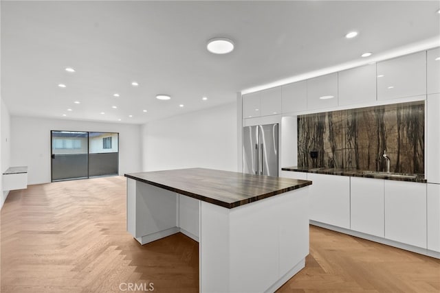 330 N Jackson St Unit 313, Glendale, CA 91206 - kitchen featuring stainless steel refrigerator, modern cabinets, recessed lighting, and white cabinets