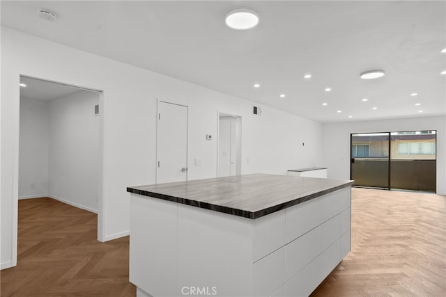 330 N Jackson St Unit 313, Glendale, CA 91206 - kitchen with white cabinets, dark countertops, recessed lighting, a kitchen island, and modern cabinets