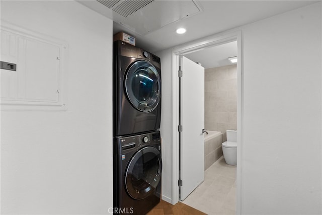 330 N Jackson St Unit 313, Glendale, CA 91206 - laundry room with stacked washer and clothes dryer, electric panel, and recessed lighting
