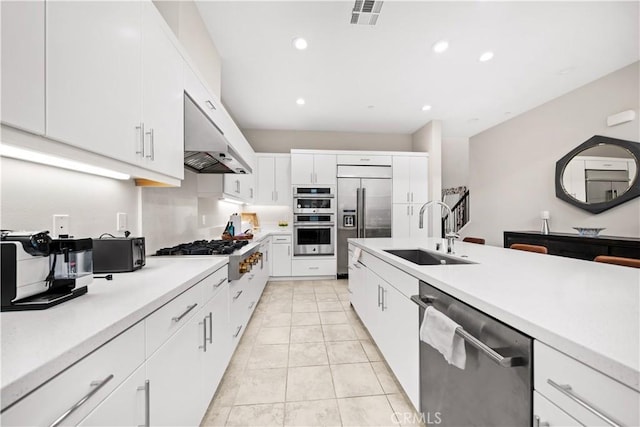 151 Fremont, Lake Forest, CA 92630 - kitchen featuring stainless steel appliances, under cabinet range hood, light countertops, white cabinets, and recessed lighting