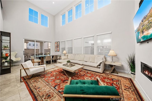 151 Fremont, Lake Forest, CA 92630 - living room featuring a towering ceiling and a glass covered fireplace