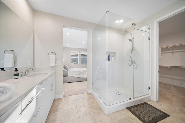 151 Fremont, Lake Forest, CA 92630 - full bathroom featuring a stall shower, double vanity, tile patterned flooring, a walk in closet, and ensuite bath