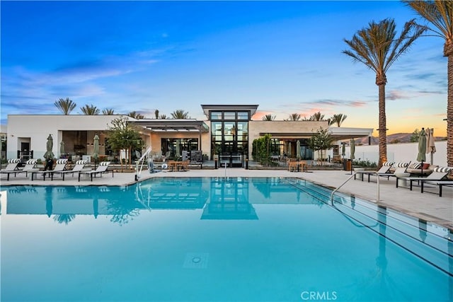 151 Fremont, Lake Forest, CA 92630 - pool at dusk featuring a community pool and a patio area