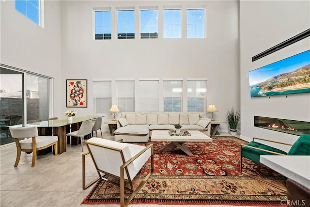 151 Fremont, Lake Forest, CA 92630 - tiled living room with a towering ceiling, plenty of natural light, and a glass covered fireplace