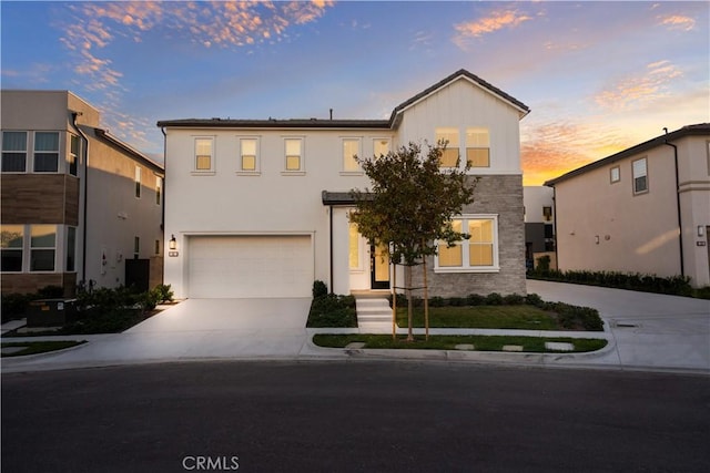 151 Fremont, Lake Forest, CA 92630 - view of front facade featuring concrete driveway, a garage, and stone siding