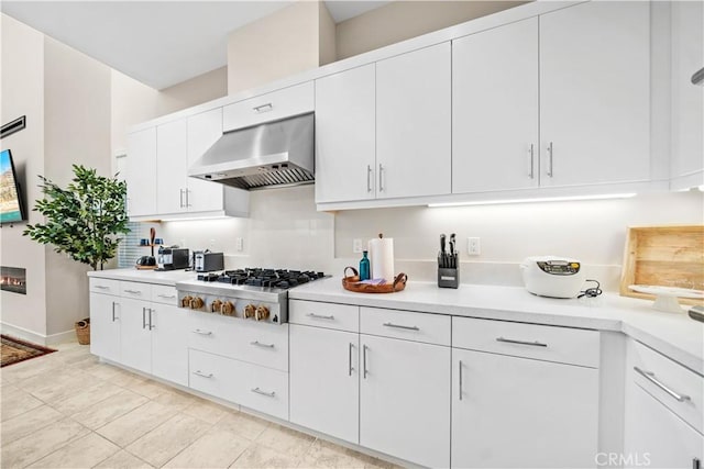 151 Fremont, Lake Forest, CA 92630 - kitchen featuring ventilation hood, stainless steel gas cooktop, light countertops, and white cabinetry