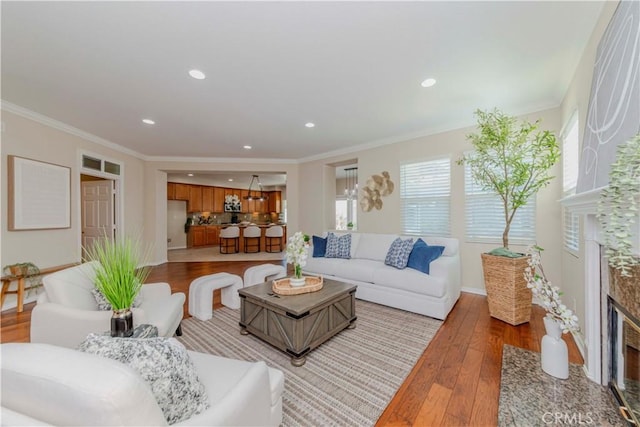 2142 Root St, Fullerton, CA 92833 - living room with light wood finished floors, a premium fireplace, ornamental molding, and recessed lighting