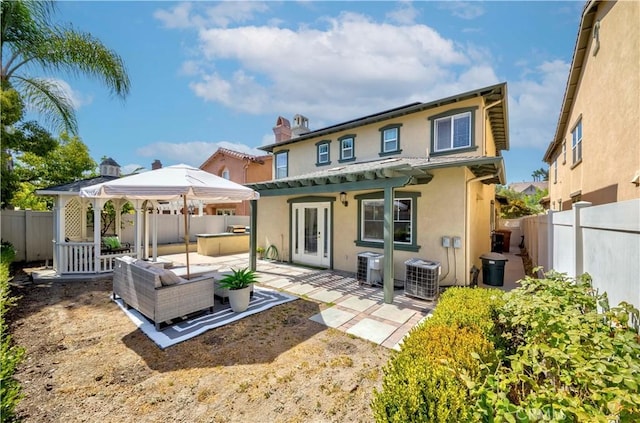 2142 Root St, Fullerton, CA 92833 - back of house featuring a gazebo, outdoor lounge area, stucco siding, a fenced backyard, and a patio area