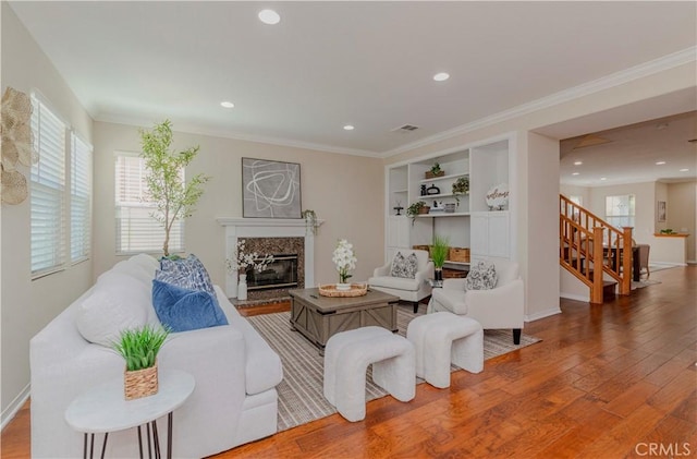 2142 Root St, Fullerton, CA 92833 - living room with stairway, a premium fireplace, wood finished floors, recessed lighting, and ornamental molding