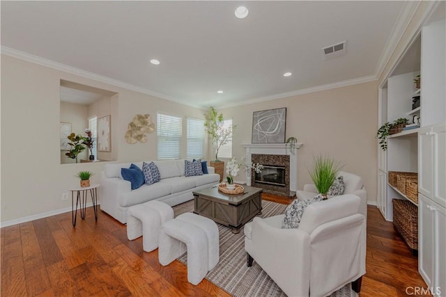 2142 Root St, Fullerton, CA 92833 - living room with a premium fireplace, wood finished floors, ornamental molding, and recessed lighting