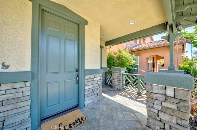 2142 Root St, Fullerton, CA 92833 - property entrance with stucco siding and a porch