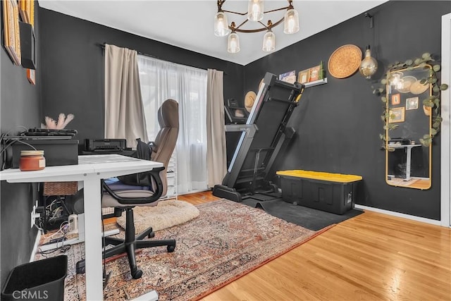 7708 Birchleaf Ave, Pico Rivera, CA 90660 - office area featuring wood finished floors and a chandelier