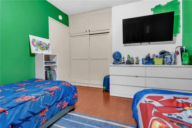 7708 Birchleaf Ave, Pico Rivera, CA 90660 - bedroom featuring wood finished floors and a closet