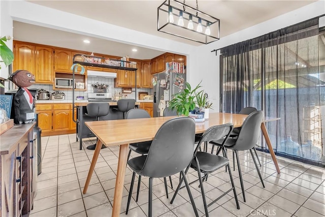 7708 Birchleaf Ave, Pico Rivera, CA 90660 - dining space with light tile patterned floors and recessed lighting