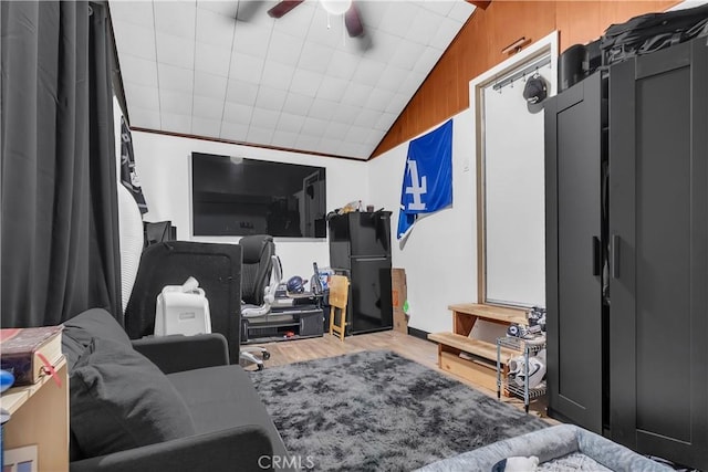7708 Birchleaf Ave, Pico Rivera, CA 90660 - living area featuring a ceiling fan, wood finished floors, and lofted ceiling