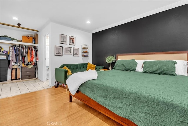 7708 Birchleaf Ave, Pico Rivera, CA 90660 - bedroom featuring wood finished floors, a closet, recessed lighting, a walk in closet, and crown molding