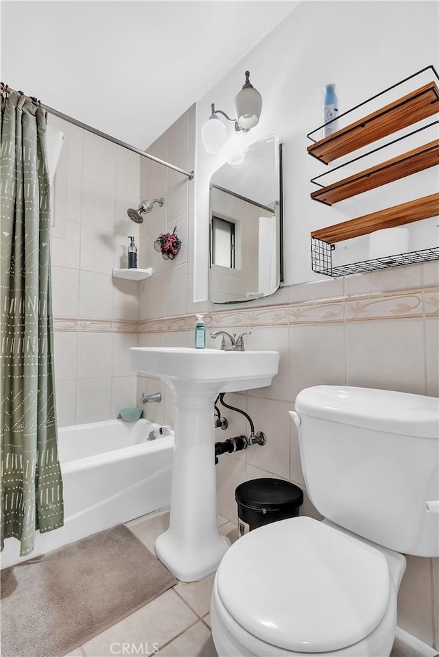 7708 Birchleaf Ave, Pico Rivera, CA 90660 - bathroom featuring shower / tub combo, tile patterned flooring, and tile walls