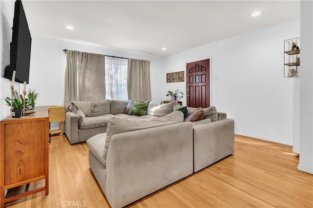 7708 Birchleaf Ave, Pico Rivera, CA 90660 - living area featuring light wood-style floors and recessed lighting