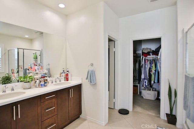 233 47th St, Long Beach, CA 90805 - full bathroom featuring a stall shower, double vanity, tile patterned floors, and a walk in closet