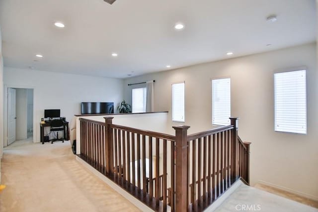 233 47th St, Long Beach, CA 90805 - hallway featuring recessed lighting, light colored carpet, a desk, and an upstairs landing