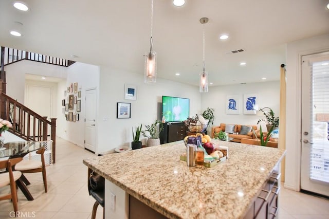 233 47th St, Long Beach, CA 90805 - kitchen with light tile patterned flooring, a kitchen island, hanging light fixtures, light stone countertops, and recessed lighting
