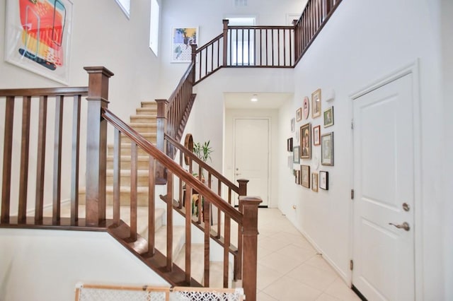 233 47th St, Long Beach, CA 90805 - staircase featuring a high ceiling and tile patterned floors