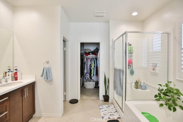 233 47th St, Long Beach, CA 90805 - full bathroom featuring vanity, a stall shower, tile patterned flooring, and a walk in closet