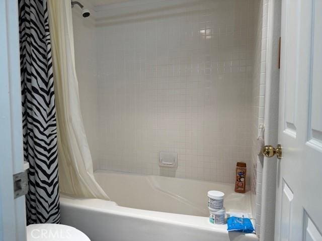 3211 Sello Ln Unit 100, Carlsbad, CA 92009 - bathroom featuring shower / bath combination with curtain and toilet