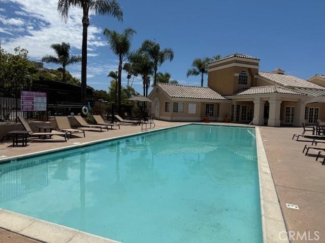 3211 Sello Ln Unit 100, Carlsbad, CA 92009 - community pool featuring a patio area