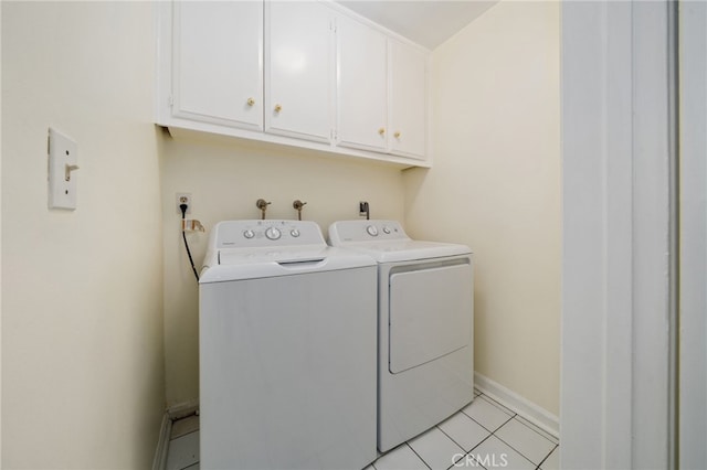 11265 Gardiners Ct, Cypress, CA 90630 - washroom with washer and clothes dryer, cabinet space, and light tile patterned floors