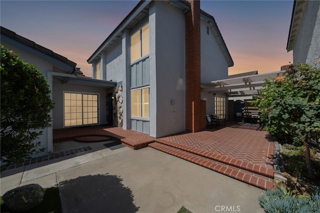 11265 Gardiners Ct, Cypress, CA 90630 - rear view of property featuring a patio, a pergola, and stucco siding