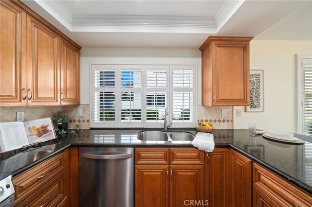11265 Gardiners Ct, Cypress, CA 90630 - kitchen featuring stainless steel dishwasher, brown cabinetry, healthy amount of natural light, dark stone counters, and ornamental molding