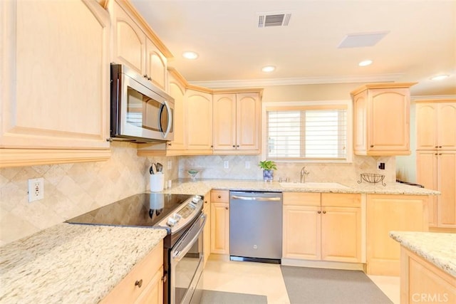 3242 San Amadeo Unit 2D, Laguna Woods, CA 92637 - kitchen featuring stainless steel appliances, light brown cabinets, light stone countertops, ornamental molding, and recessed lighting