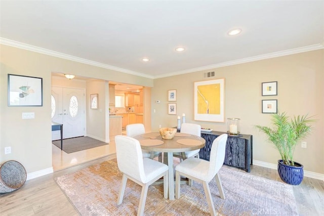 3242 San Amadeo Unit 2D, Laguna Woods, CA 92637 - dining space featuring light wood finished floors, ornamental molding, and recessed lighting