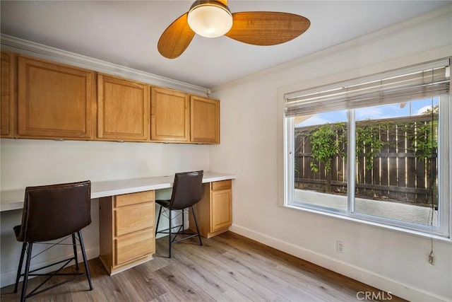 1205 Cerca, San Clemente, CA 92673 - home office featuring built in study area, ornamental molding, plenty of natural light, light wood finished floors, and ceiling fan