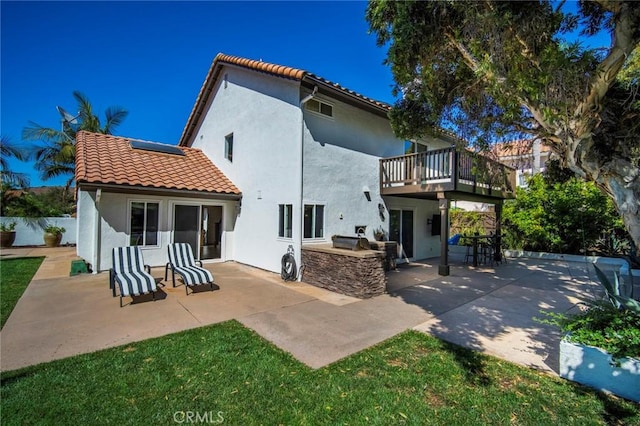 1205 Cerca, San Clemente, CA 92673 - rear view of property featuring an outdoor kitchen, a tile roof, a patio area, and stucco siding
