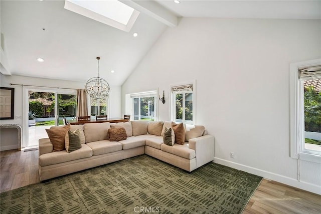 1205 Cerca, San Clemente, CA 92673 - living area featuring a skylight, light wood-style flooring, beamed ceiling, a chandelier, and high vaulted ceiling
