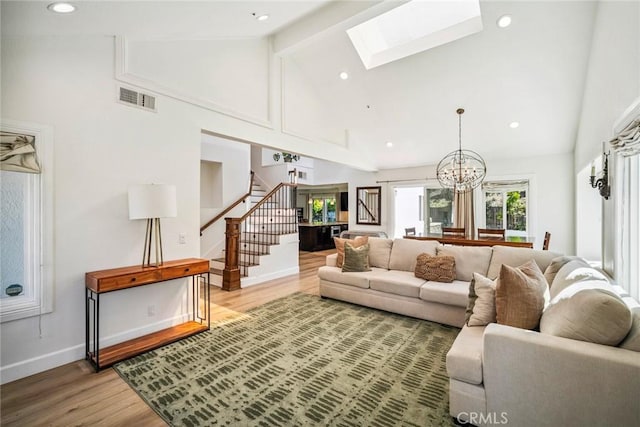 1205 Cerca, San Clemente, CA 92673 - living area with high vaulted ceiling, stairs, light wood-type flooring, a skylight, and beamed ceiling