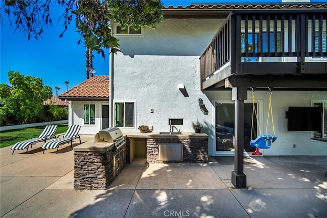 1205 Cerca, San Clemente, CA 92673 - back of house with area for grilling, a balcony, stucco siding, a patio, and a tiled roof