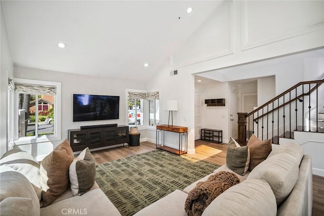 1205 Cerca, San Clemente, CA 92673 - living area featuring wood finished floors, high vaulted ceiling, stairway, and recessed lighting