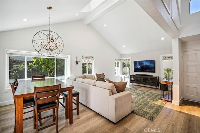 1205 Cerca, San Clemente, CA 92673 - living area with high vaulted ceiling, a skylight, beam ceiling, healthy amount of natural light, and light wood-style floors