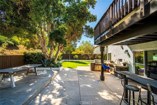 1205 Cerca, San Clemente, CA 92673 - fenced backyard with outdoor dining area, a patio area, and an outdoor kitchen