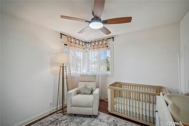 1205 Cerca, San Clemente, CA 92673 - bedroom featuring a crib, wood finished floors, and ceiling fan