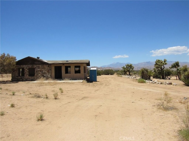 8626 La Contenta Rd, Yucca Valley, CA 92284 - view of front of house featuring a mountain view and a view of countryside