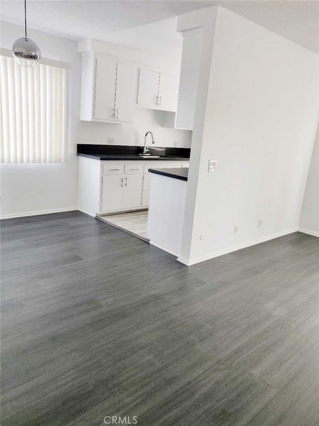 5236 Kester Ave Unit 6, Sherman Oaks, CA 91411 - kitchen with dark countertops, white cabinets, and open floor plan